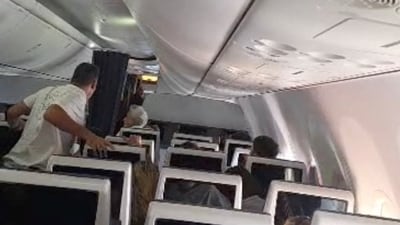 Screengrab of video showing Flydubai passengers reacting after realising there is commotion in the cockpit. (via REUTERS)